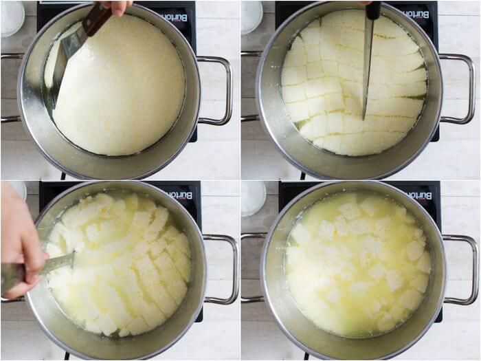 Приготовление домашней моцареллы: нарезание сырного сгустка.